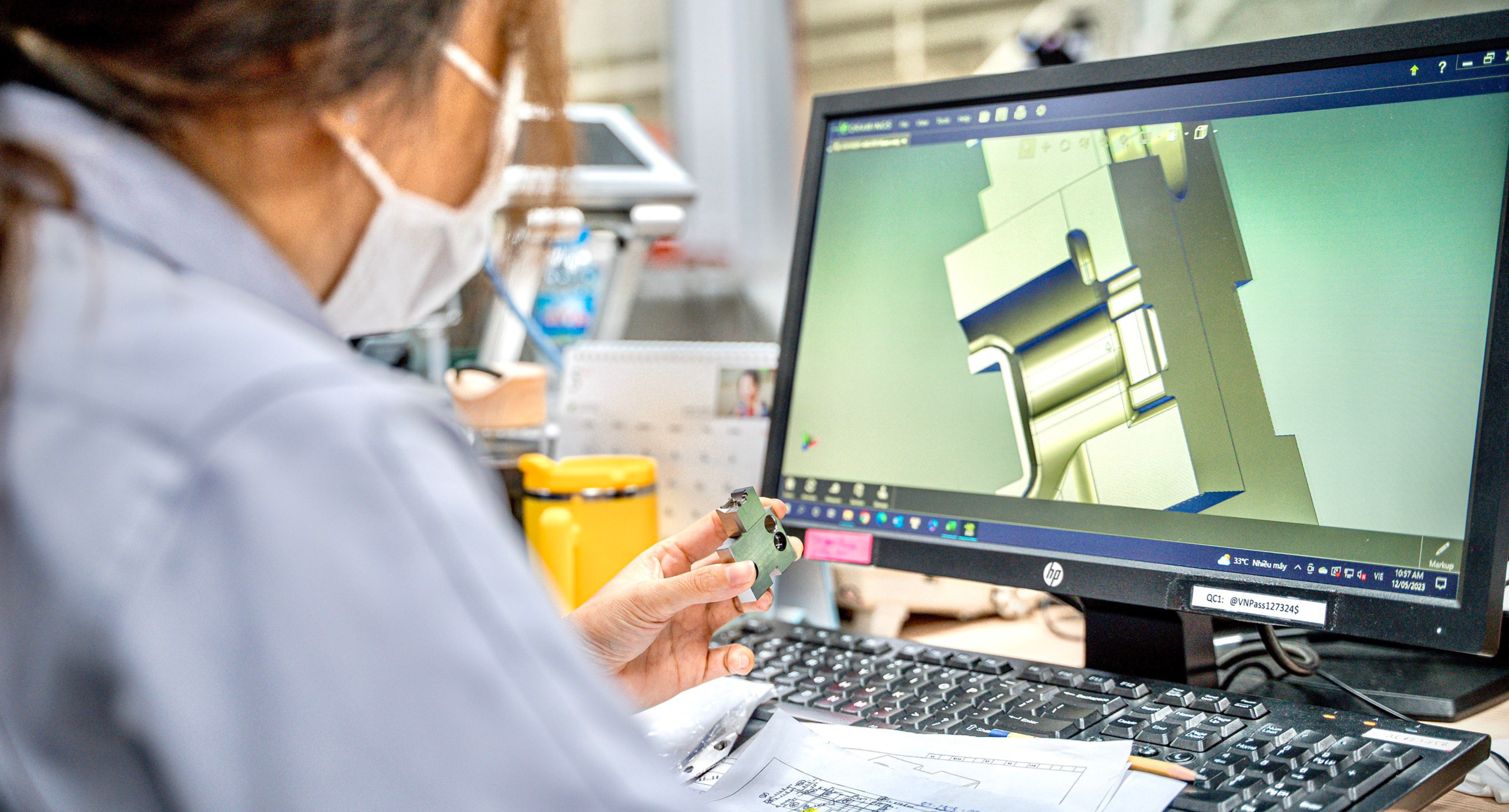 CAM Resources QC Technician checking the mold component against the CAD design