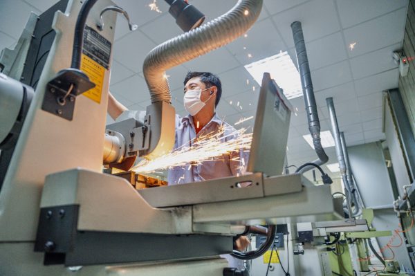 Seasoned surface grinding technician on the quest for precision Seasoned surface grinding technician on the quest for precision